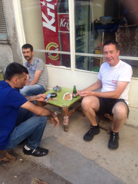 David being taken out by locals for nuts and a special drink to cure his tummy. 