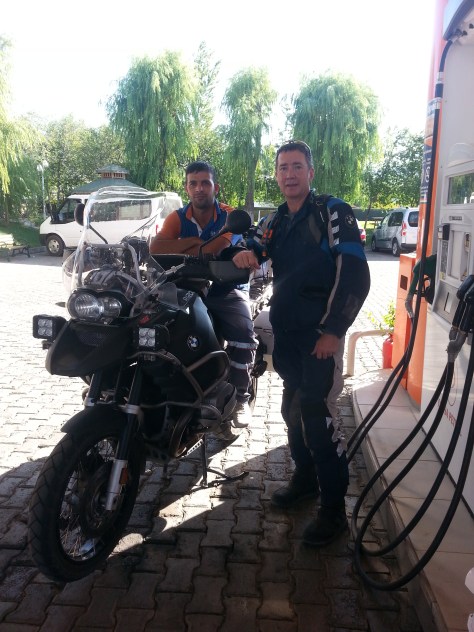 A young petrol attendant takes an opportunity to climb on board for a photo. 