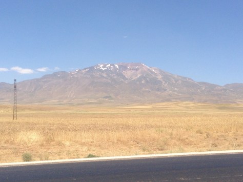 This  picture of a snow covered mountain was taken while riding in 31deg heat and sweat running off me! Odd sensation. 